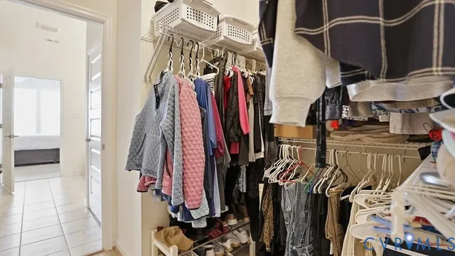 a living room with furniture a flat screen tv and a window