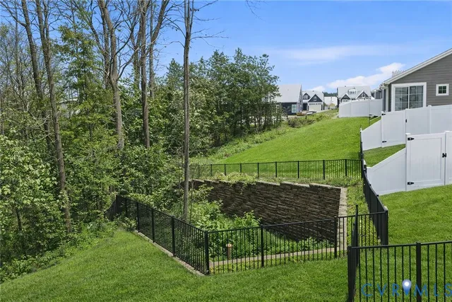 a building outdoor space with patio furniture and potted plants