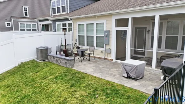 an aerial view of a house with a lake view