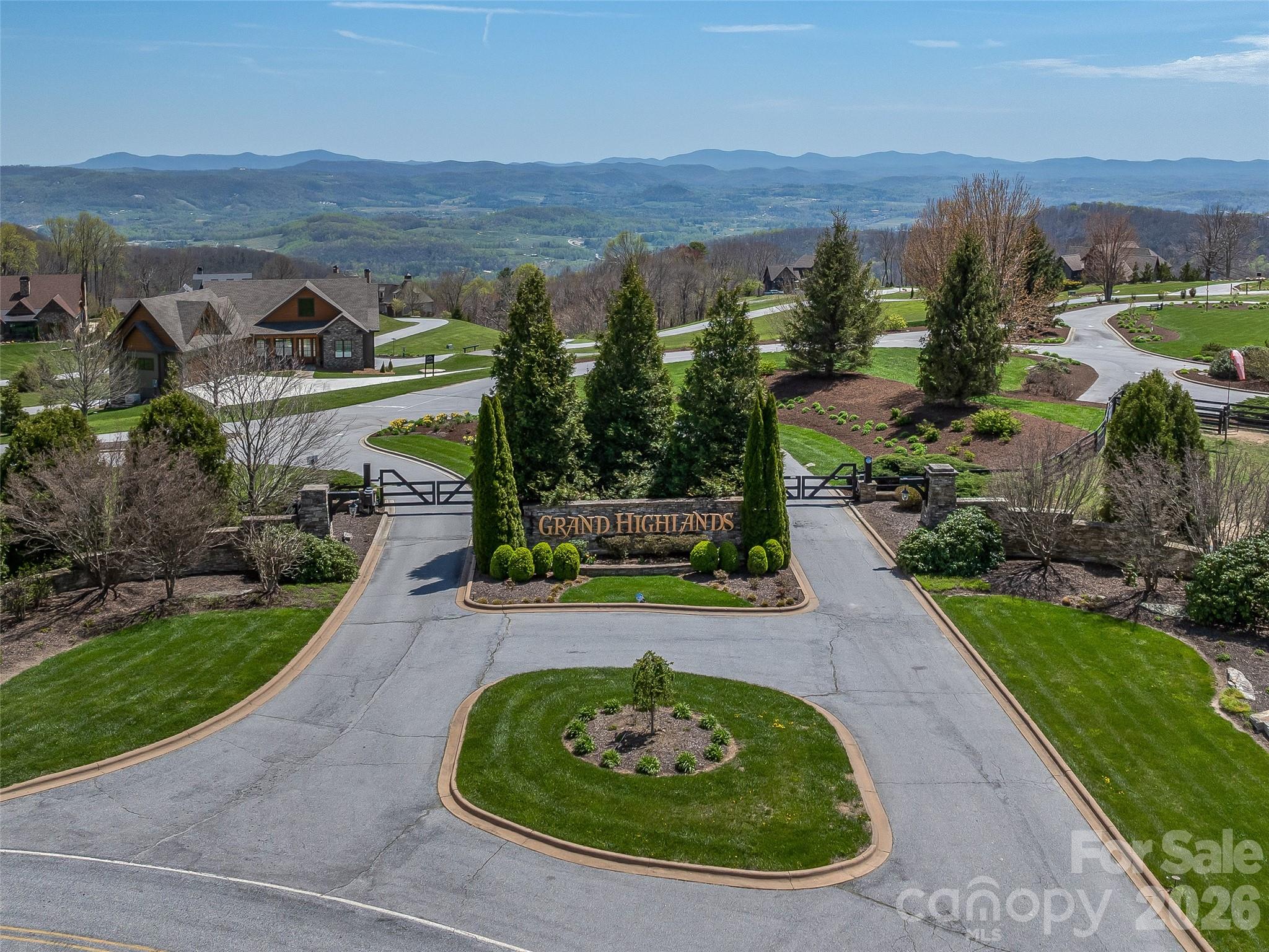 88 Autumn Ridge Lane, Unit 66 Hendersonville, NC 28792 - Photo 20 of 27 an aerial view of a house with a garden and lake view