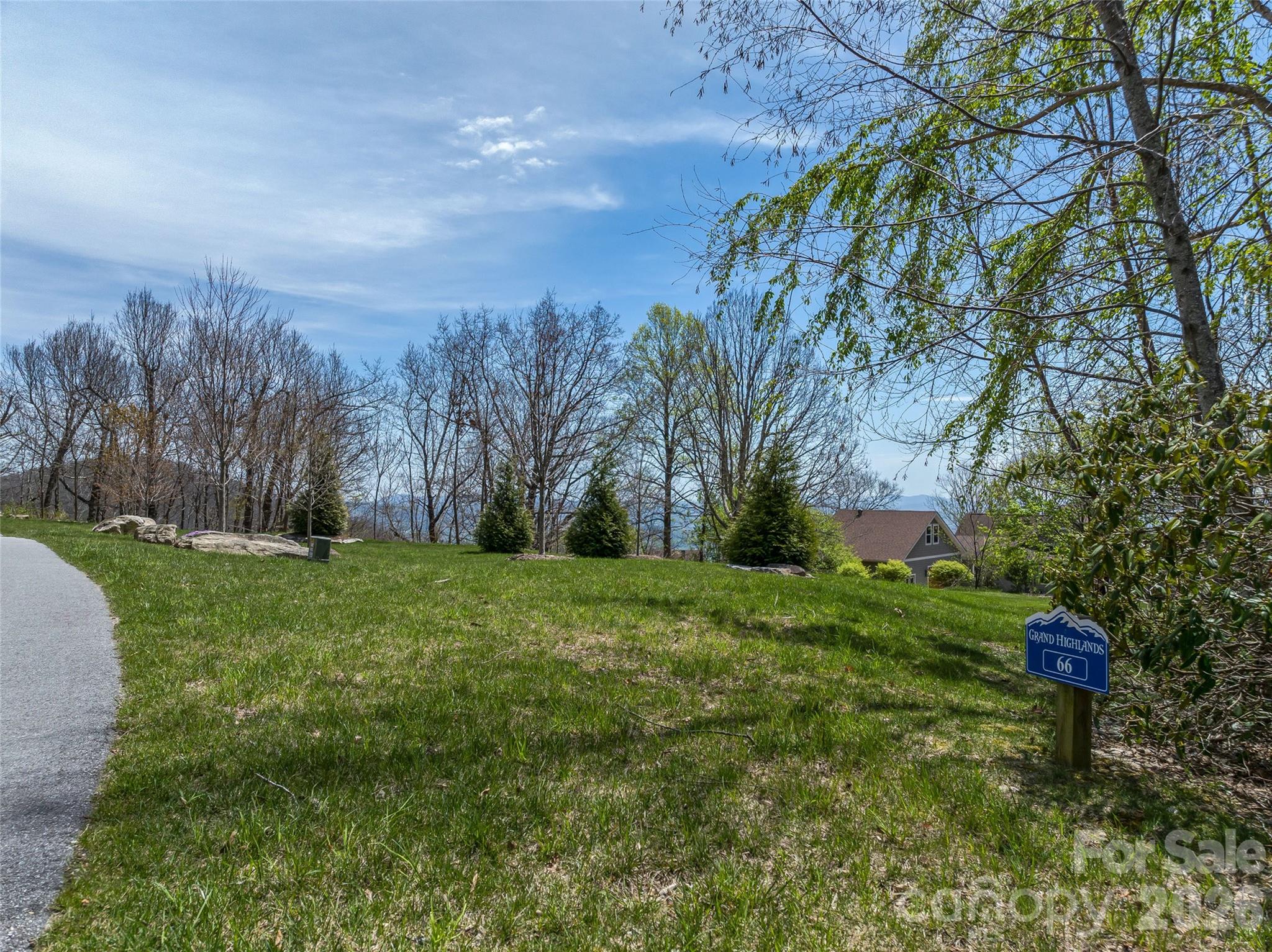 88 Autumn Ridge Lane, Unit 66 Hendersonville, NC 28792 - Photo 5 of 27 a view of a garden with trees