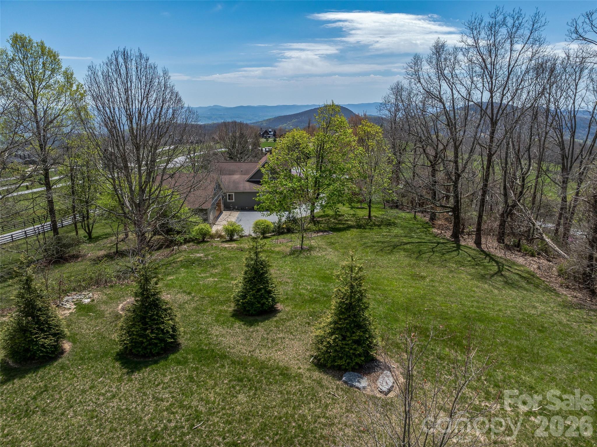 88 Autumn Ridge Lane, Unit 66 Hendersonville, NC 28792 - Photo 6 of 27 a view of a lake with a building in the background