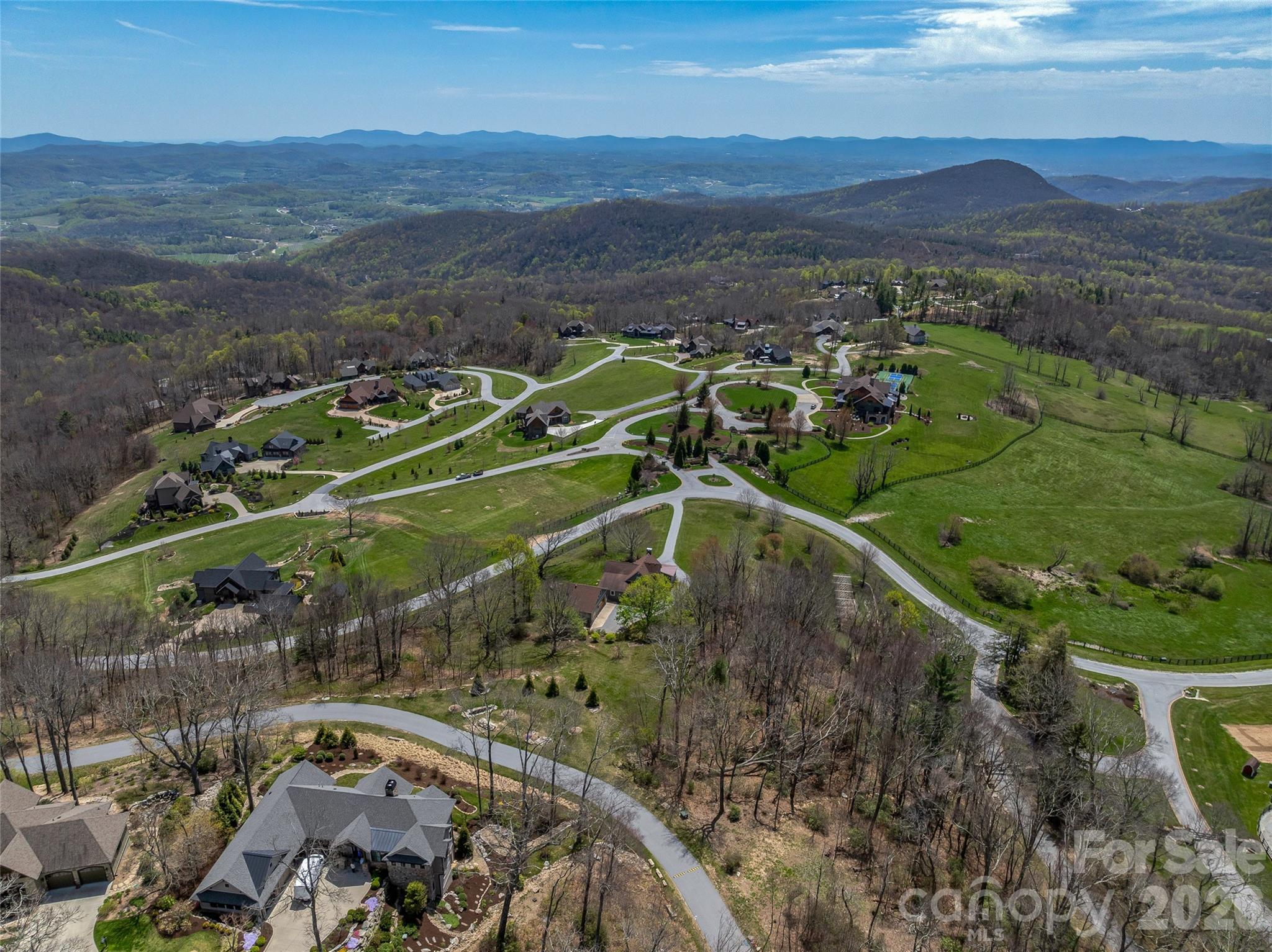 88 Autumn Ridge Lane, Unit 66 Hendersonville, NC 28792 - Photo 9 of 27 a view of a town with mountains in the background