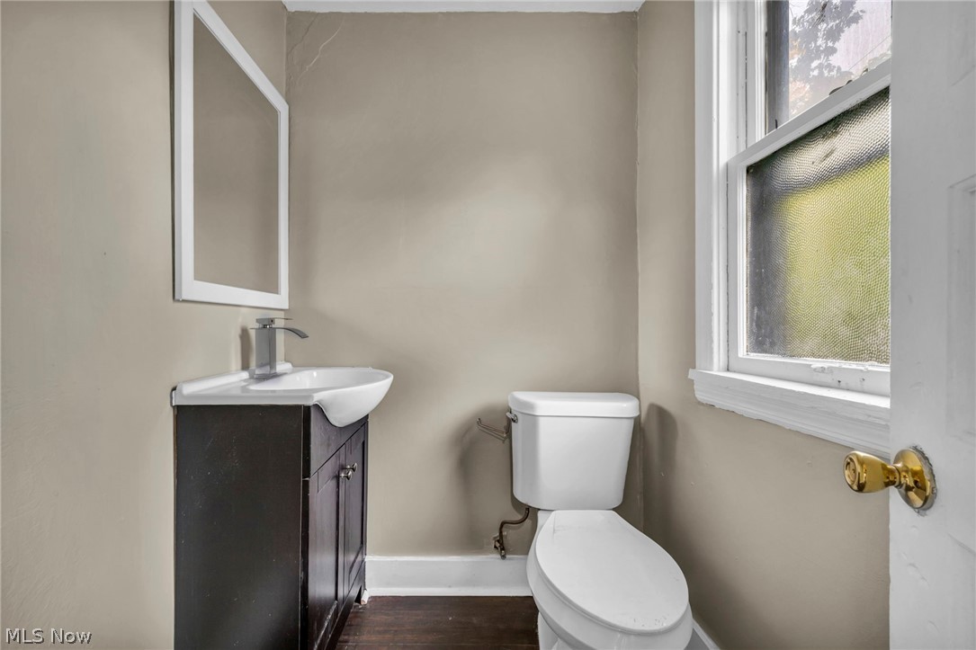 1677 Carlyon Road East Cleveland, OH 44112 - Photo 31 of 41 Bathroom featuring vanity and dark wood-type flooring