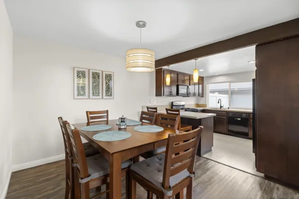 a kitchen with a table and chairs in it