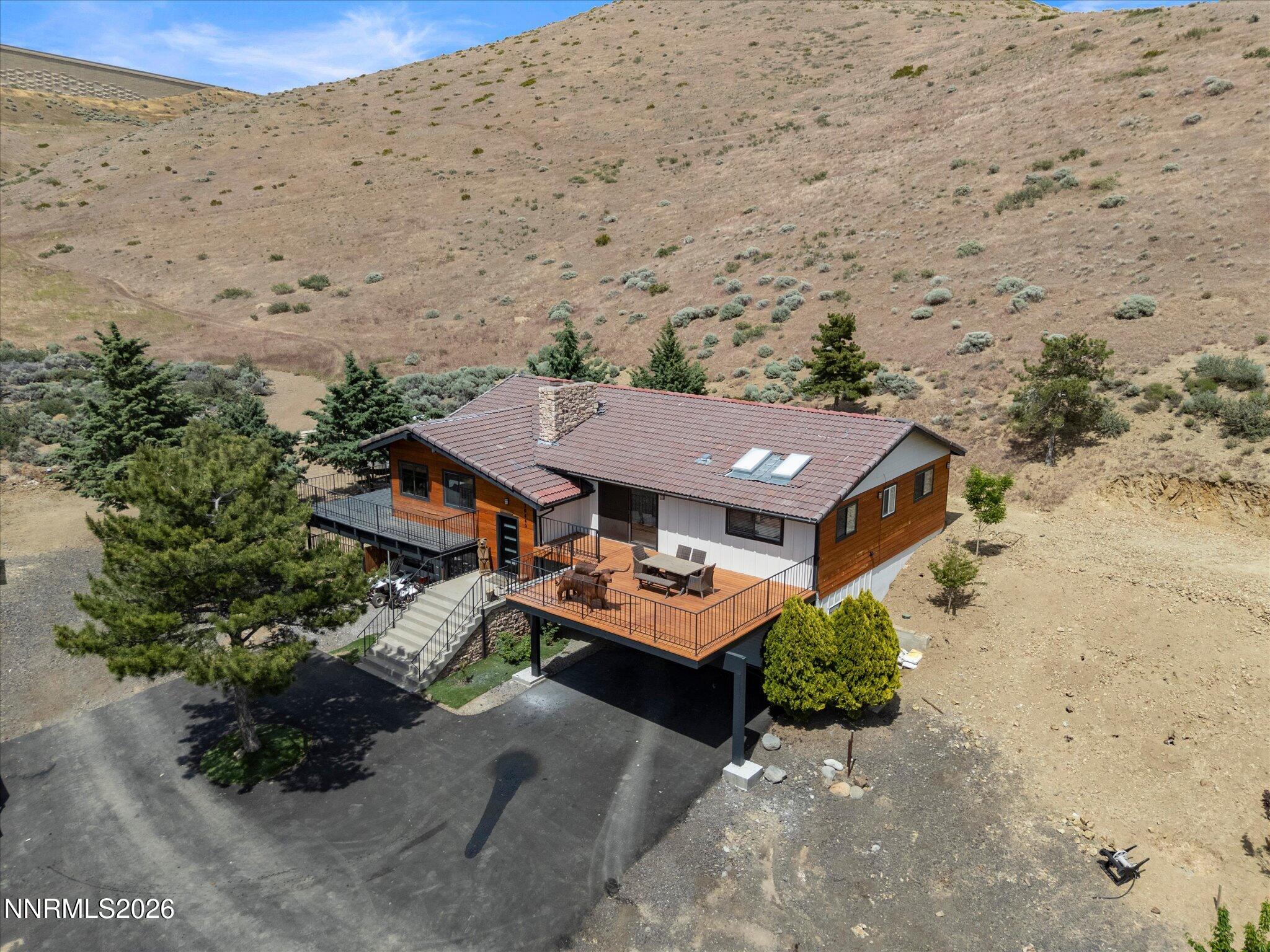 20449 Temelec Way Reno, NV 89521 - Photo 9 of 65 an aerial view of a house with a mountain