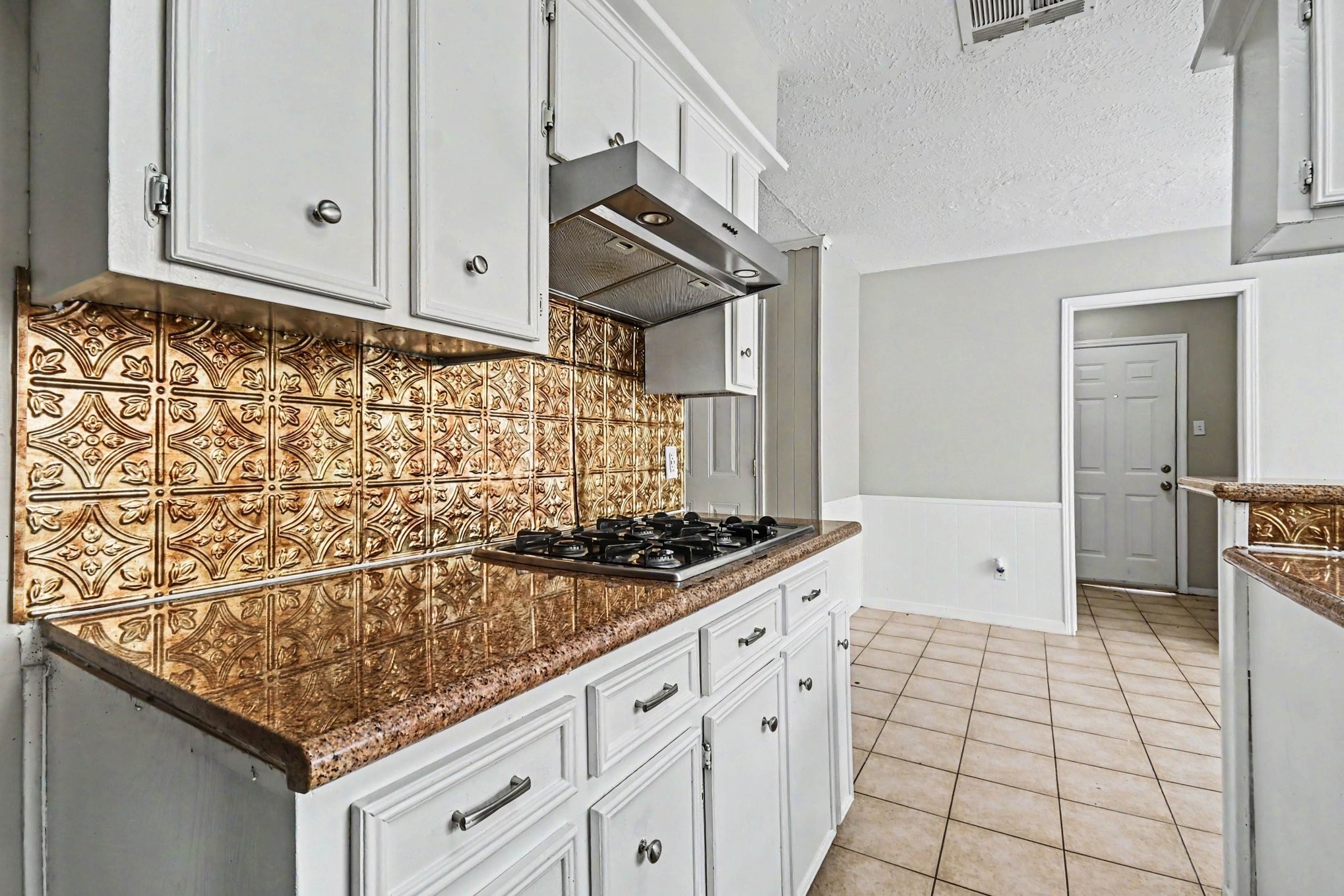 4306 Oneida Street Pasadena, TX 77504 - Photo 7 of 23 a kitchen with stainless steel appliances granite countertop a stove and a sink