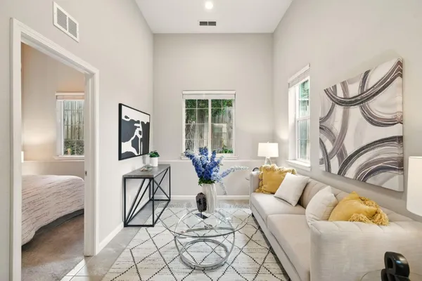a living room with furniture and a window