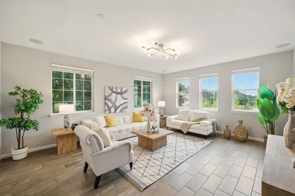 a living room with furniture and a large window