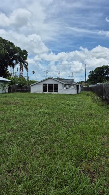 730 Stremma Road Largo, FL 33770 - Photo 1 of 7 view of a house with a big yard