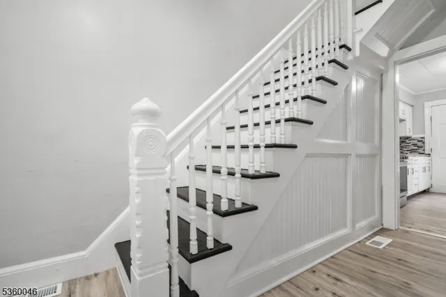 a view of entryway with wooden floor