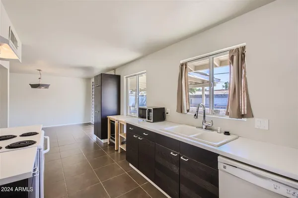 a spacious bathroom with a double vanity sink mirror and