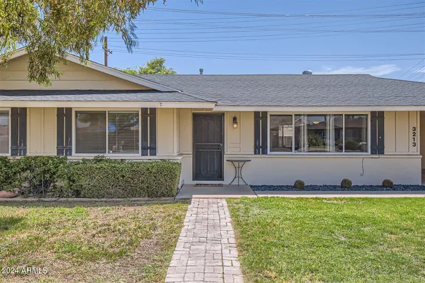 a front view of a house with a yard