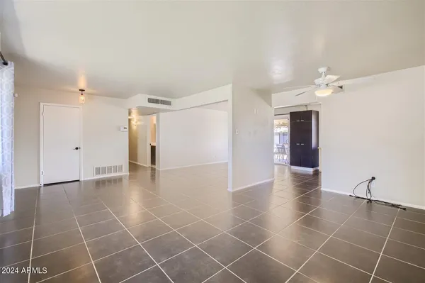 a view of an empty room with a window