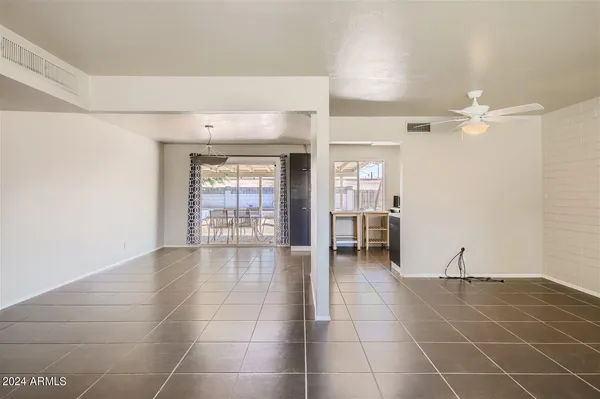 a view of an empty room with glass door
