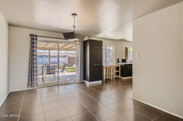 a room with lots of counter top space and windows