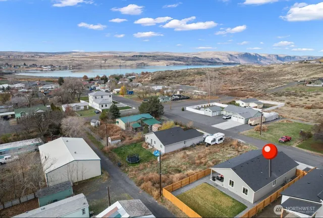 an aerial view of residential houses with outdoor space