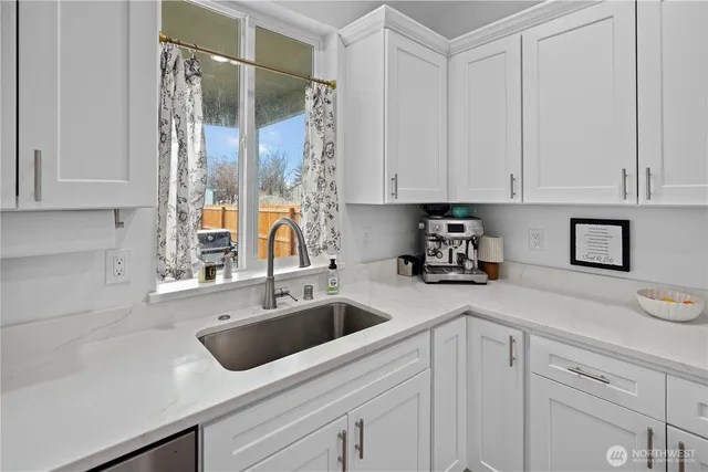 a kitchen with a sink and cabinets