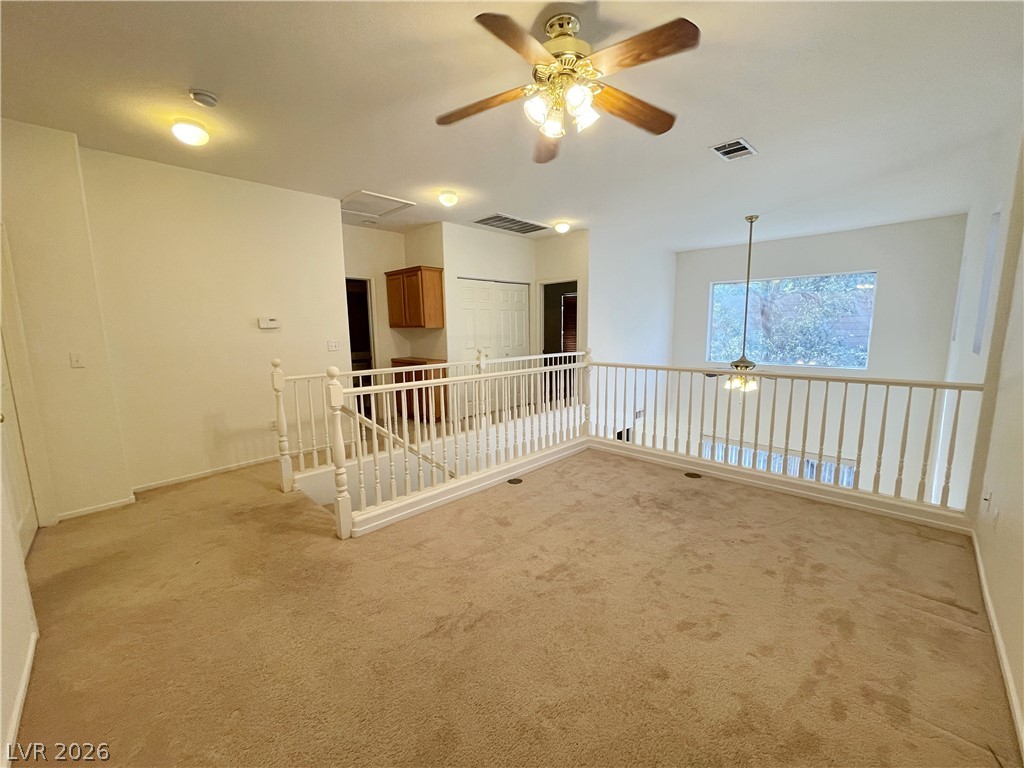 691 Principle Point Avenue Henderson, NV 89012 - Photo 16 of 30 An airy loft area offers versatile space, overlooking the home below with natural illumination.