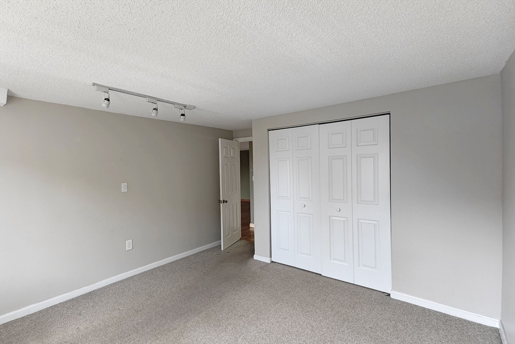 8 9th Street, Unit 406 Medford, MA 02155 - Photo 14 of 21 a view of an empty room