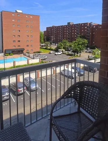 a view of a swimming pool with a patio