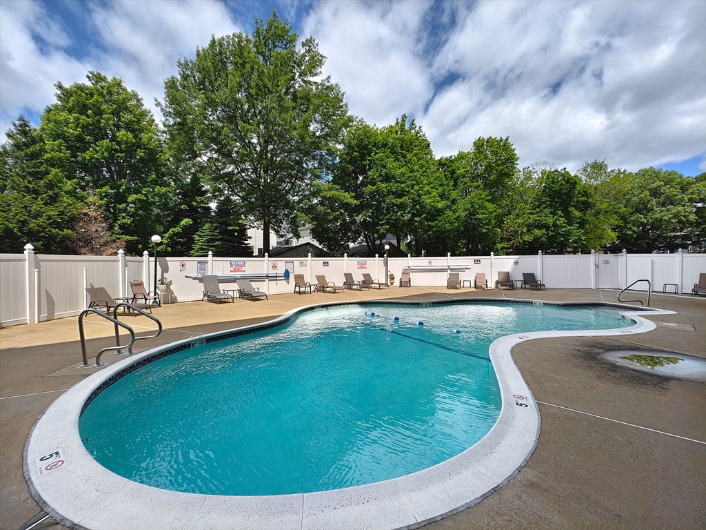 8 9th Street, Unit 406 Medford, MA 02155 - Photo 19 of 21 a view of a swimming pool with a patio