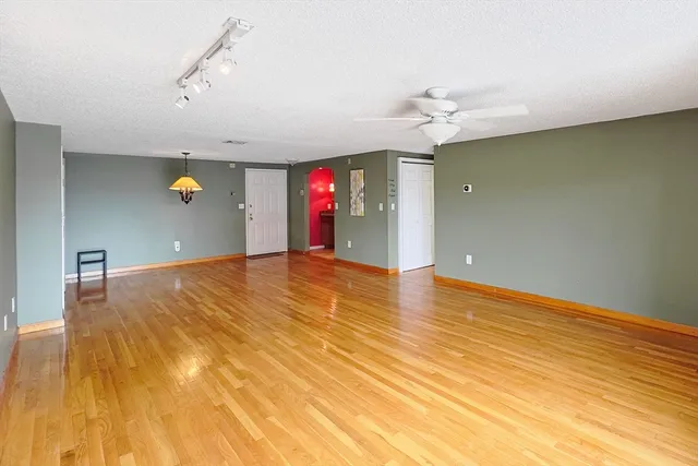 a view of a room with a wooden floor