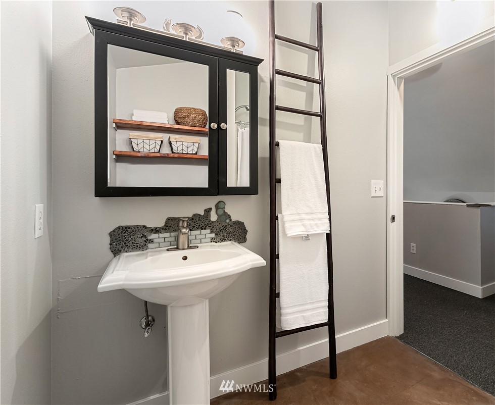 467 Cove Road Bellingham, WA 98229 - Photo 20 of 40 a bathroom with a sink and a mirror