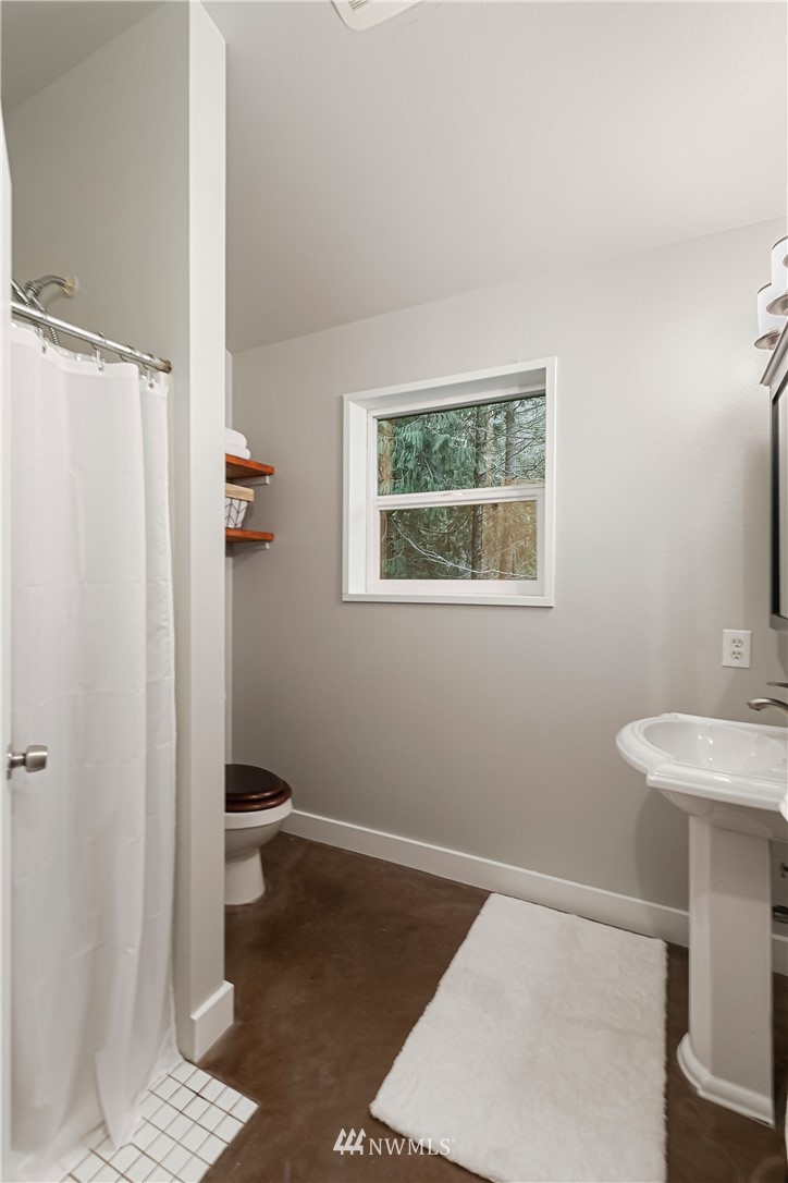 467 Cove Road Bellingham, WA 98229 - Photo 21 of 40 a bathroom with a sink and a toilet