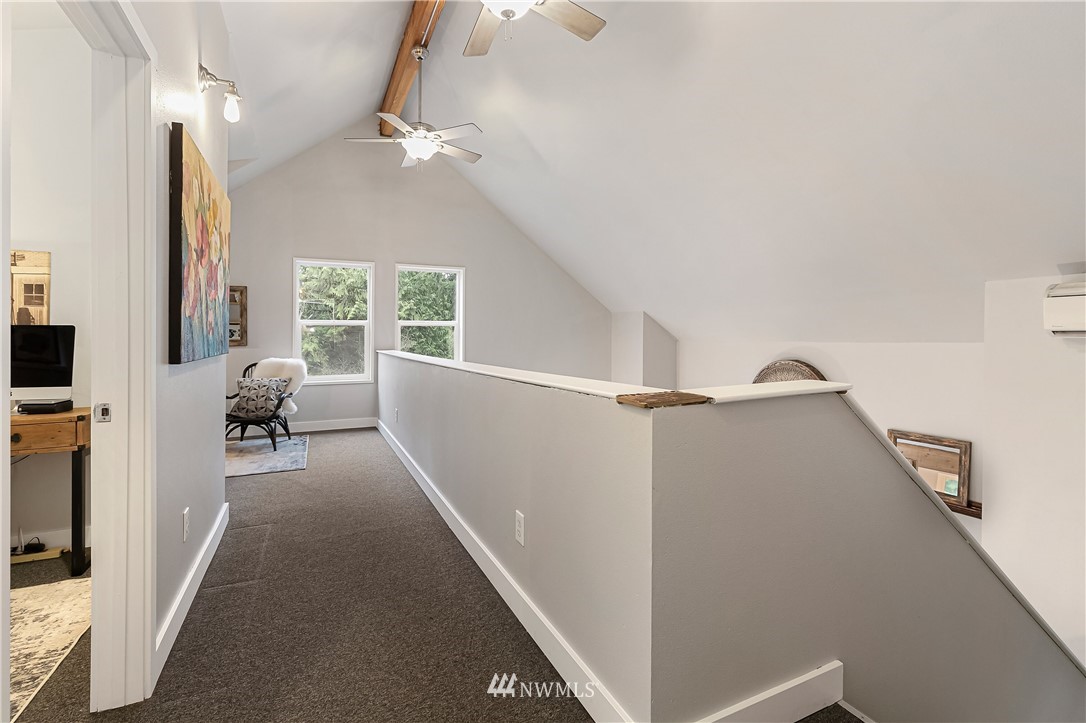 467 Cove Road Bellingham, WA 98229 - Photo 23 of 40 a living room with furniture and a chandelier