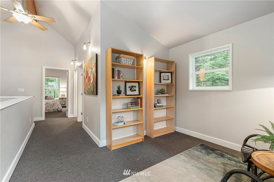 467 Cove Road Bellingham, WA 98229 - Photo 24 of 40 a view of room with cabinet and a ceiling fan