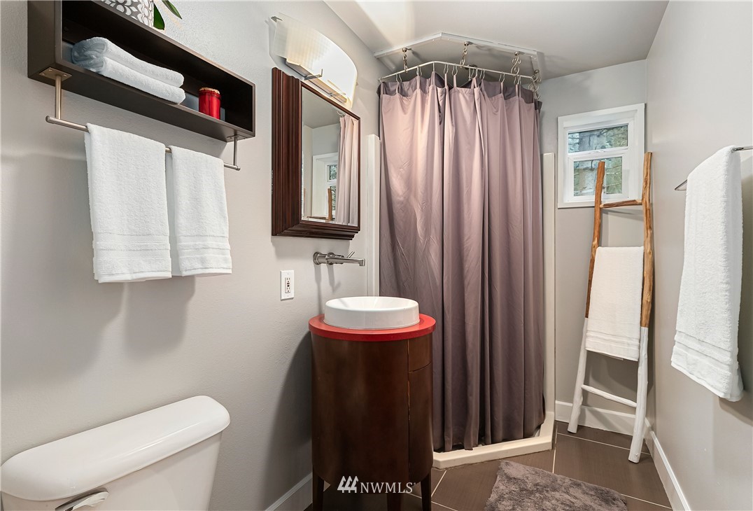 467 Cove Road Bellingham, WA 98229 - Photo 27 of 40 a bathroom with a toilet a sink and a shower