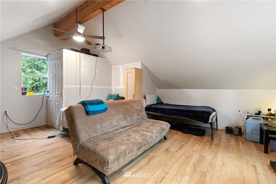 467 Cove Road Bellingham, WA 98229 - Photo 30 of 40 a living room with furniture ceiling fan and a window