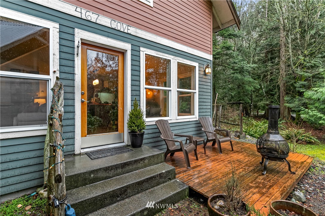 467 Cove Road Bellingham, WA 98229 - Photo 4 of 40 a view of a house with backyard wooden deck and sitting area