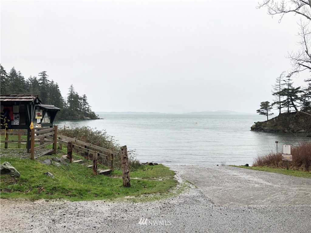 467 Cove Road Bellingham, WA 98229 - Photo 38 of 40 a view of a lake with a yard