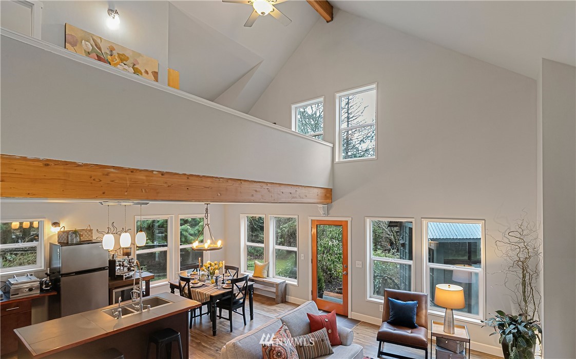 467 Cove Road Bellingham, WA 98229 - Photo 10 of 40 a view of a workspace with furniture and floor to ceiling window