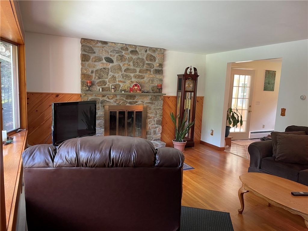 371 Weaver Hill Road Coventry, RI 02816 - Photo 11 of 28 Living room with beautiful stone fireplace