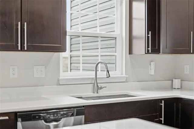 a kitchen with a sink and cabinets