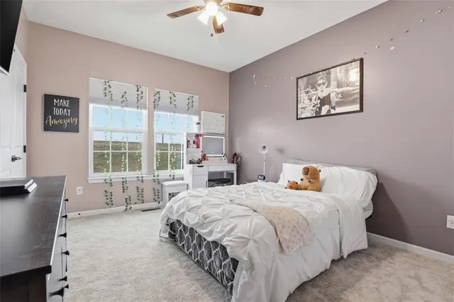 a bedroom with bed and a window