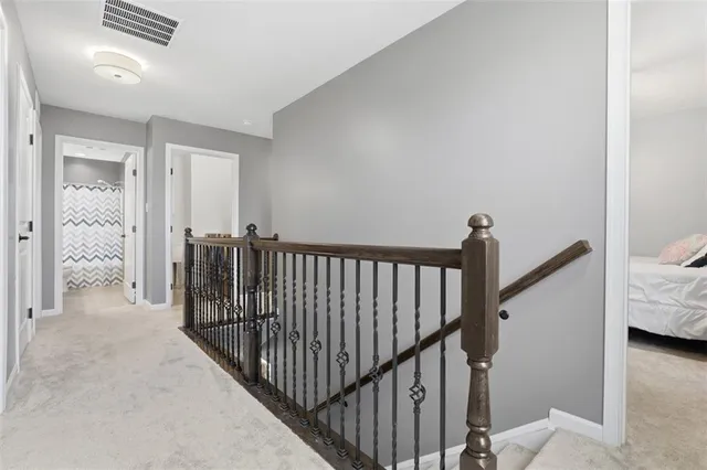 a view of a hallway view with staircase