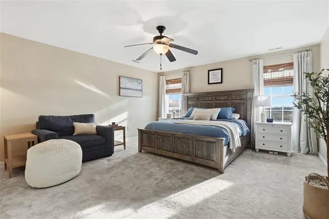 a bedroom with bed and window