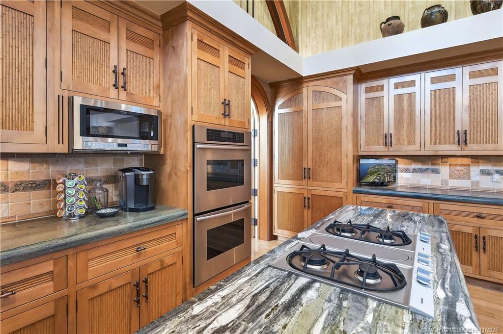1210 Northwest Winters Creek Road Palm City, FL 34990 - Photo 22 of 73 2 Wall Ovens - Inlayed Bamboo Custom Cabinetry.