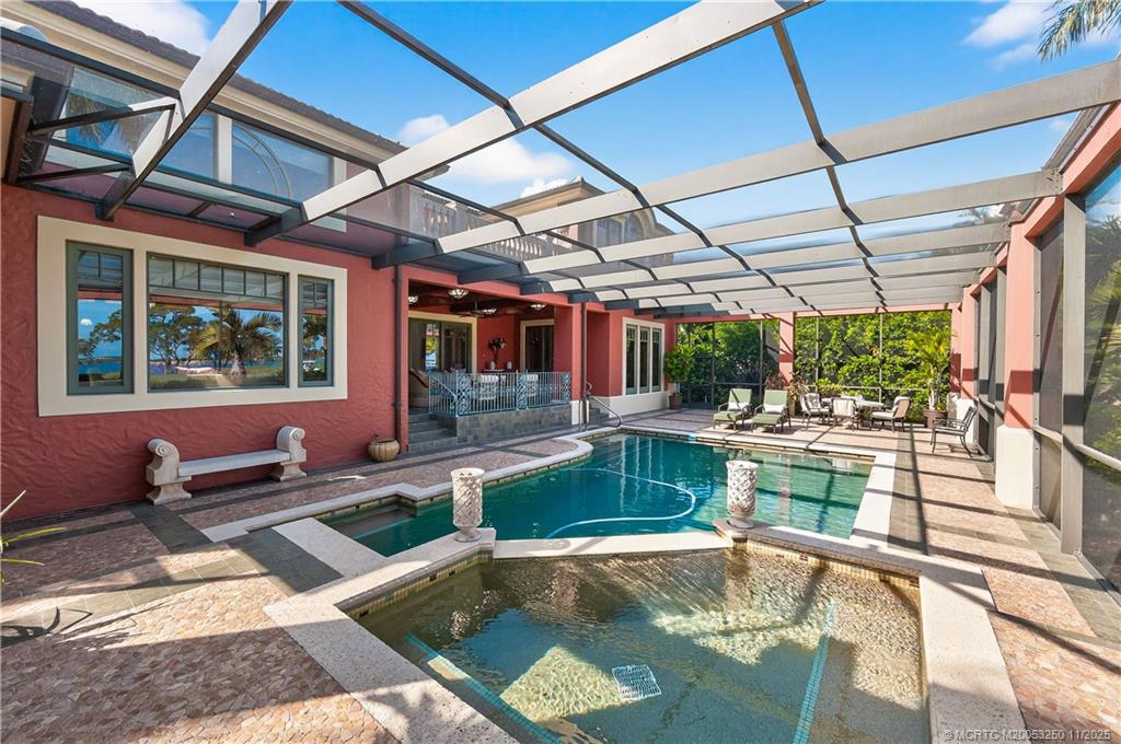 1210 Northwest Winters Creek Road Palm City, FL 34990 - Photo 53 of 73 What's not to love about this screen-enclosed pool and patio?