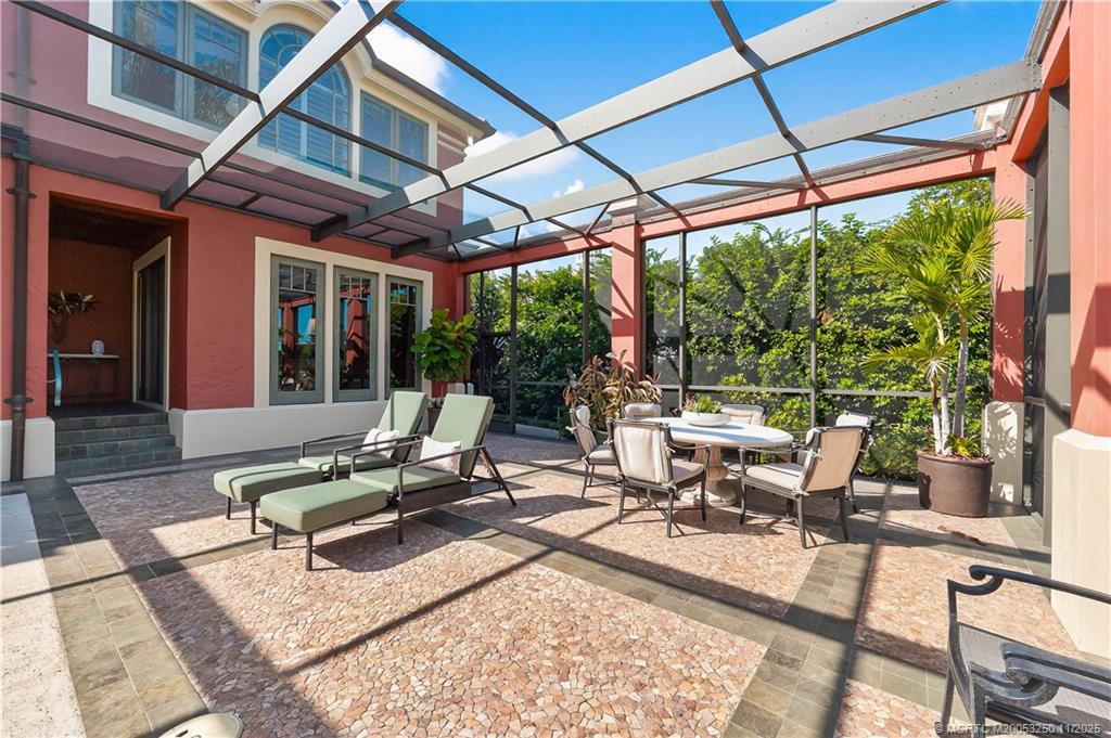 1210 Northwest Winters Creek Road Palm City, FL 34990 - Photo 59 of 73 Plenty of Sunning & Dining on the Screen-Enclosed Patio