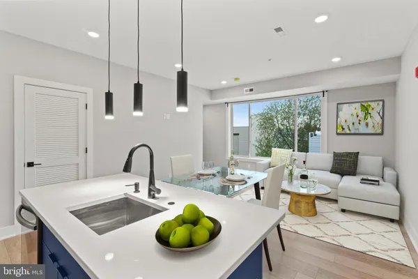 a kitchen with a table and chairs
