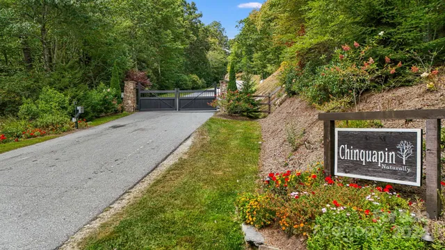 a sign that is in front of flowers