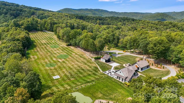 a view of a backyard with a small cabin