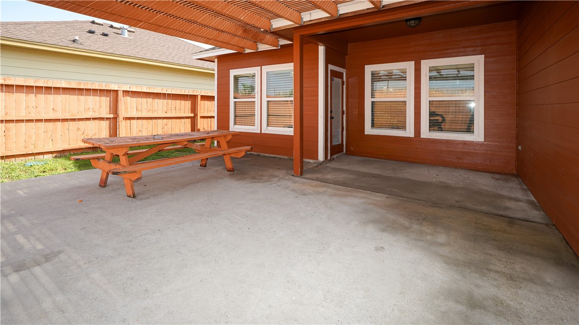 6809 Summer Wind Drive Corpus Christi, TX 78413 - Photo 25 of 27 a backyard of a house with outdoor seating