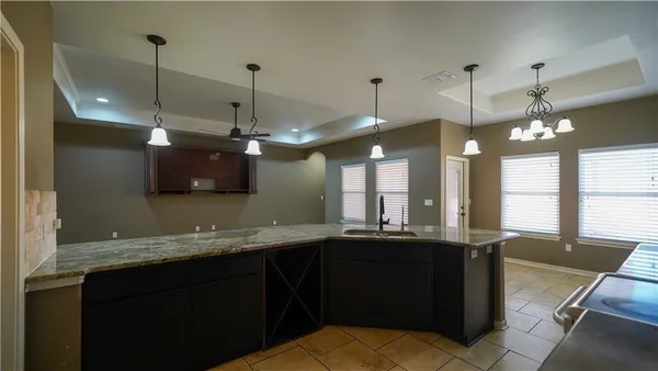 a bathroom with a sink and a large mirror
