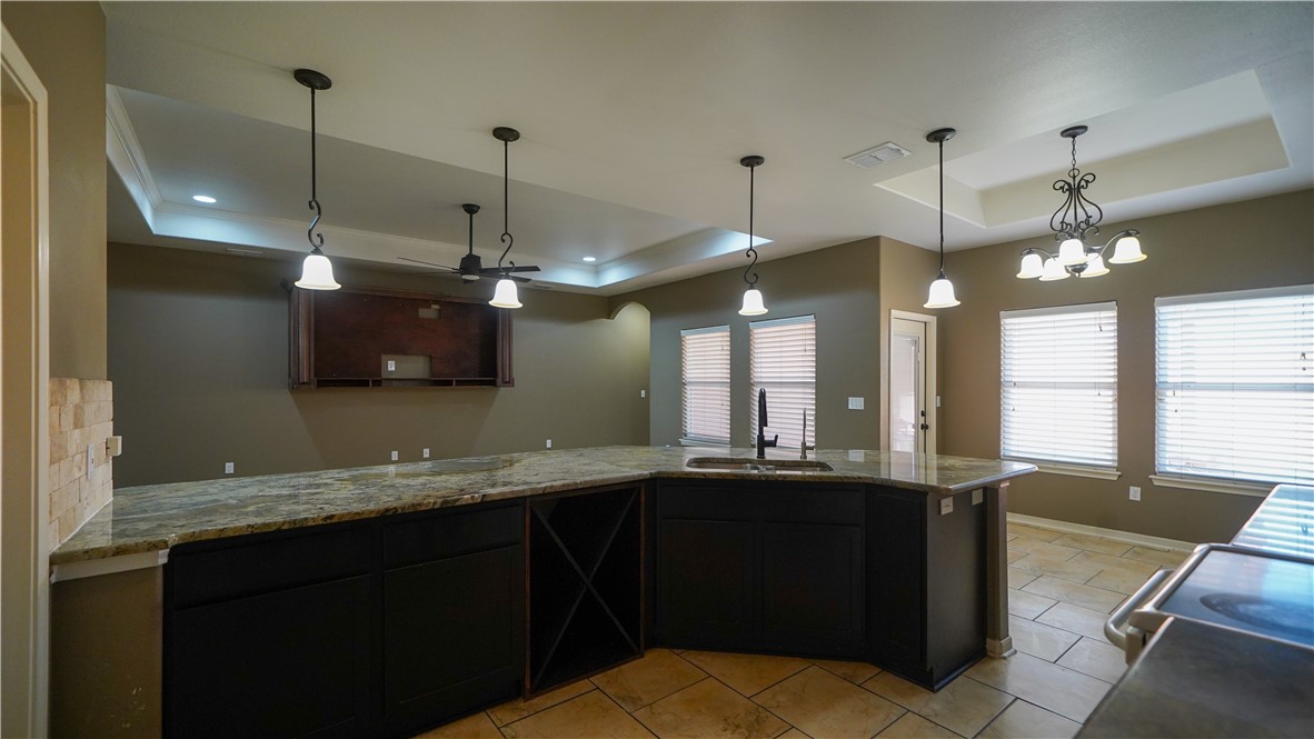 6809 Summer Wind Drive Corpus Christi, TX 78413 - Photo 8 of 27 a bathroom with a sink and a large mirror